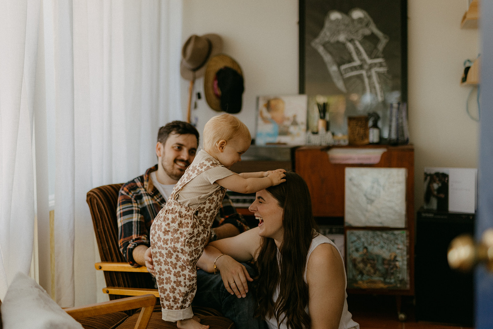 Family snuggled together on the couch during their in-home session